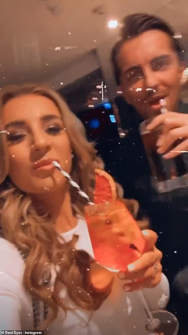 Happy: Dani Dyer insisted she's'so happy' as she drank cocktails with beau Sammy Kimmence on Friday after her ex-boyfriend Jack Fincham's announced he has welcomed his first child