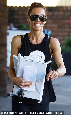 Coping well: The 38-year-old former model told Daily Mail Australia outside a gym in Sydney's Bondi Beach on Friday that she was doing fine following the separation